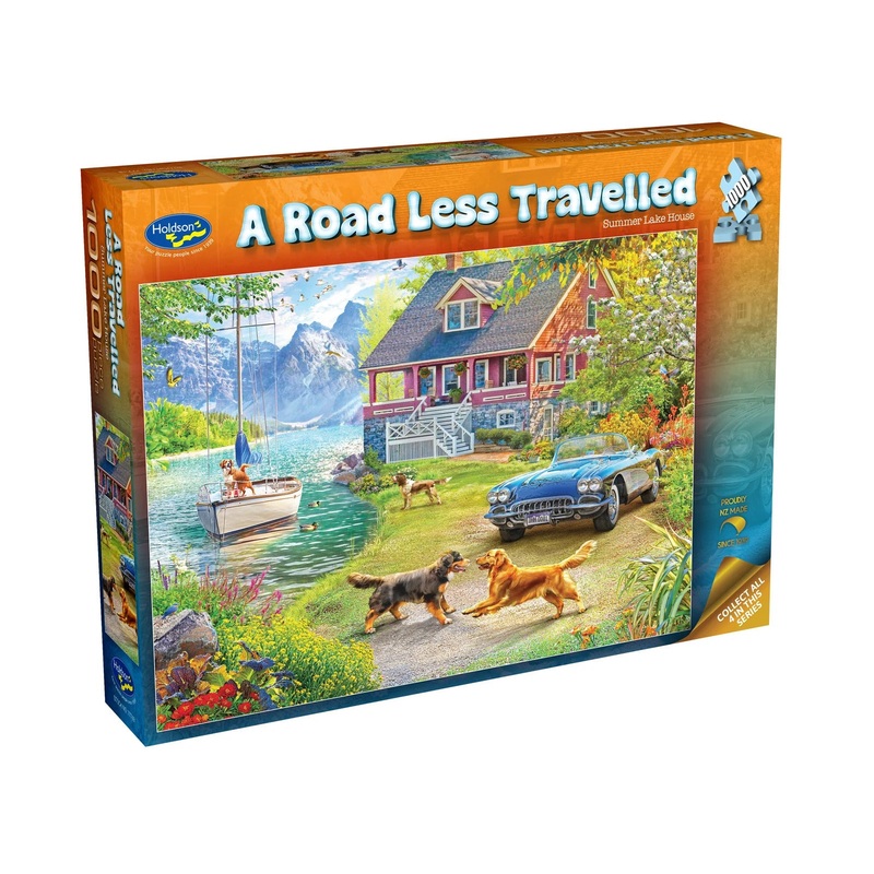 PUZZLE 1000PC ROAD LESS TRAV LAKE HOUSE
